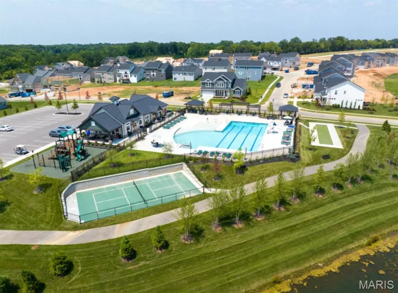 Aerial perspective of suburban area with a pool — 207 Townshead Way, O'Fallon, MO 63368