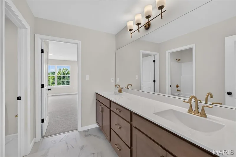 Shared bathroom with double vanity — 431 Oak Barrel Drive, O'Fallon, MO 63385