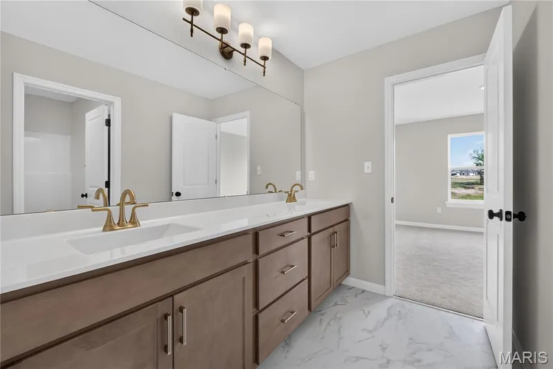 Shared bathroom with double vanity — 431 Oak Barrel Drive, O'Fallon, MO 63385