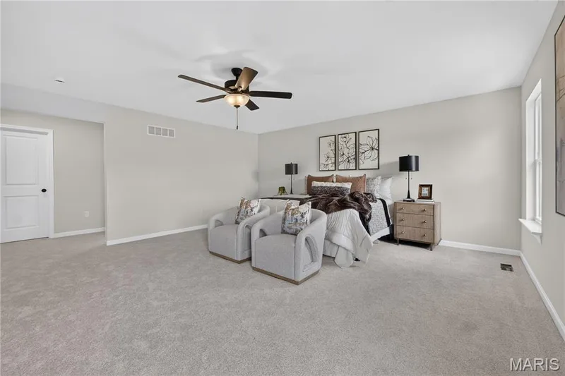 Primary bedroom with ceiling fan — 431 Oak Barrel Drive, O'Fallon, MO 63385