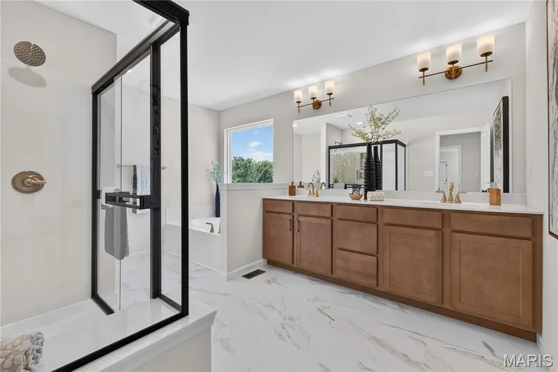 Primary bathroom with Cultured marble shower with 12 inch seat and double wave bowl vanity. — 431 Oak Barrel Drive, O'Fallon, MO 63385