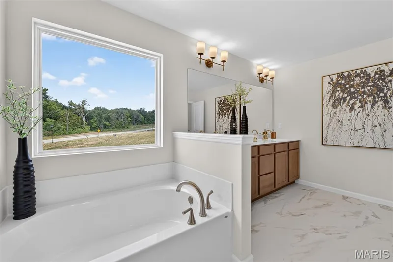 Primary bathroom with view of tub and vanity — 431 Oak Barrel Drive, O'Fallon, MO 63385