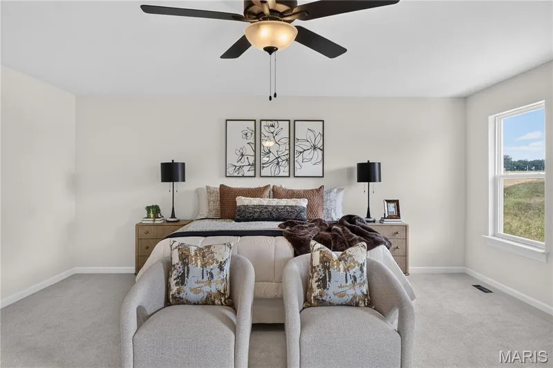 Primary bedroom with ceiling fan — 431 Oak Barrel Drive, O'Fallon, MO 63385