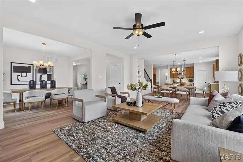 Family room with view of dining room and kitchen area — 431 Oak Barrel Drive, O'Fallon, MO 63385