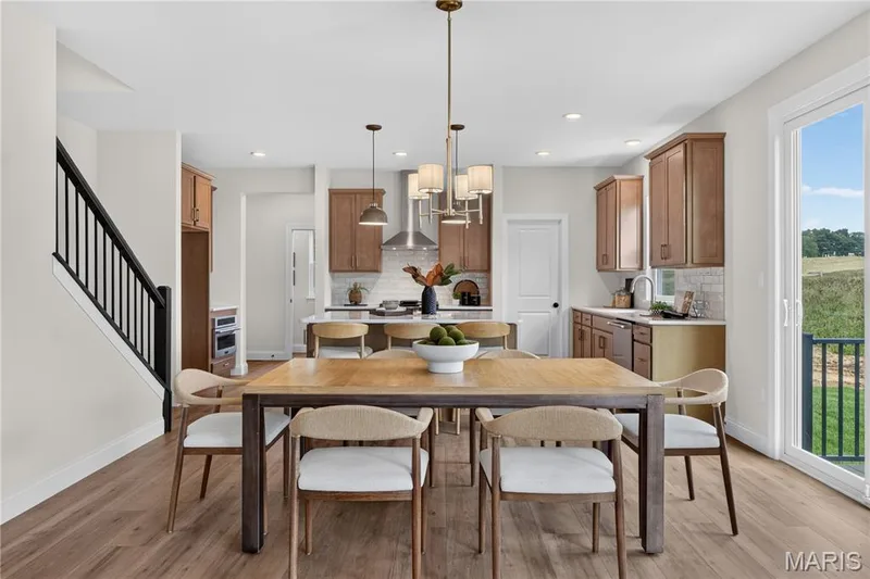 Breakfast area with view of kitchen area — 431 Oak Barrel Drive, O'Fallon, MO 63385