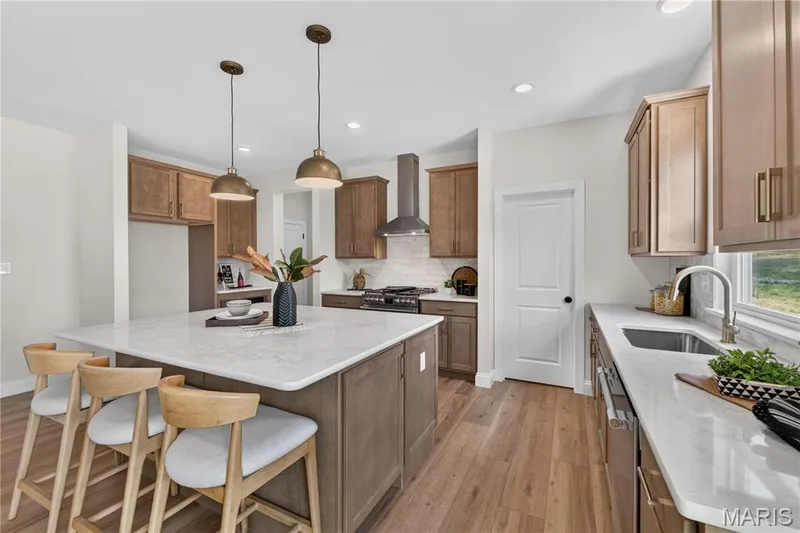 Gourmet Kitchen with Stainless steel gas appliances and Quartz countertops — 431 Oak Barrel Drive, O'Fallon, MO 63385