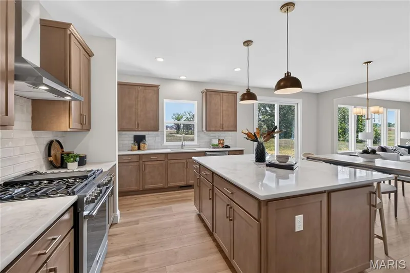 Gourmet Kitchen with Stainless steel gas appliances and Quartz countertops — 431 Oak Barrel Drive, O'Fallon, MO 63385
