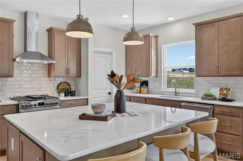 Gourmet Kitchen with Stainless steel gas appliances and Quartz countertops — 431 Oak Barrel Drive, O'Fallon, MO 63385