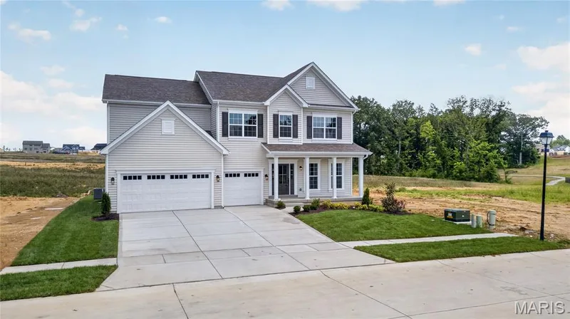 The Windsor elevation 3 by Consort Homes with a 14x14 patio, 8 ft Ingrade with 3 car garage — 431 Oak Barrel Drive, O'Fallon, MO 63385