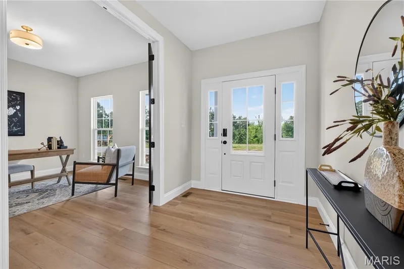 Entrance foyer with view of front door and Study — 431 Oak Barrel Drive, O'Fallon, MO 63385