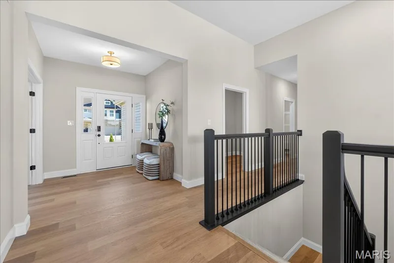 Entrance Foyer with view of front door and stairwell — 421 Farmhouse Drive, O'Fallon, MO 63385