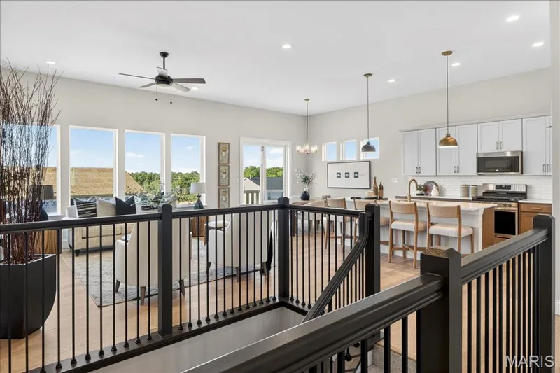 Stairwell with view of Kitchen/Great Room areas — 421 Farmhouse Drive, O'Fallon, MO 63385