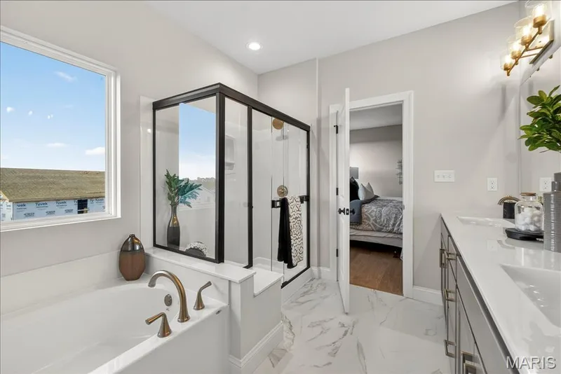 Primary Bathroom with view of tub and shower. — 421 Farmhouse Drive, O'Fallon, MO 63385