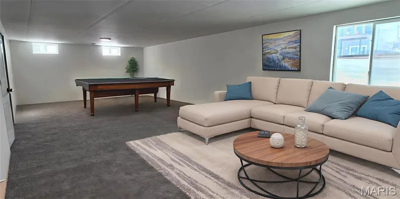 Virtually Staged - shows option as a large lower family room — 327 Dalriada Boulevard, O'Fallon, MO 63368