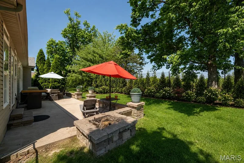 AI-enhanced image to illustrate potential landscaping. — 233 Fox Haven Drive, O'Fallon, MO 63368