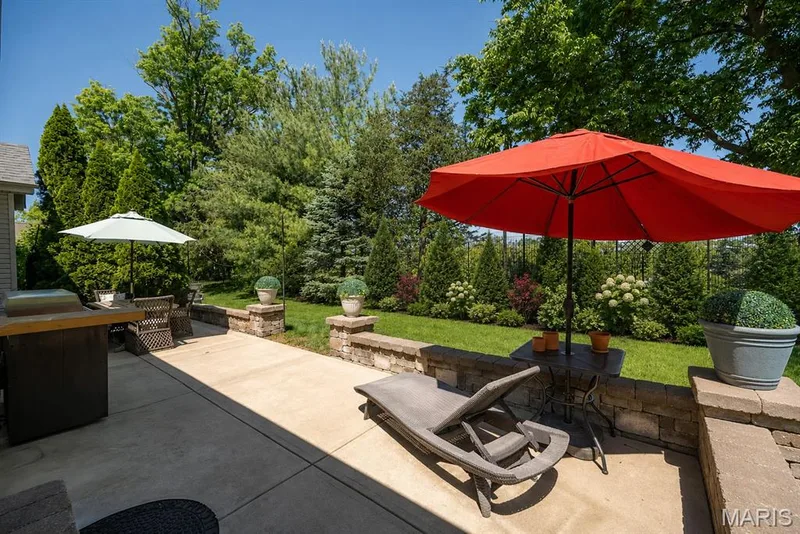 AI-enhanced image to illustrate potential landscaping. — 233 Fox Haven Drive, O'Fallon, MO 63368