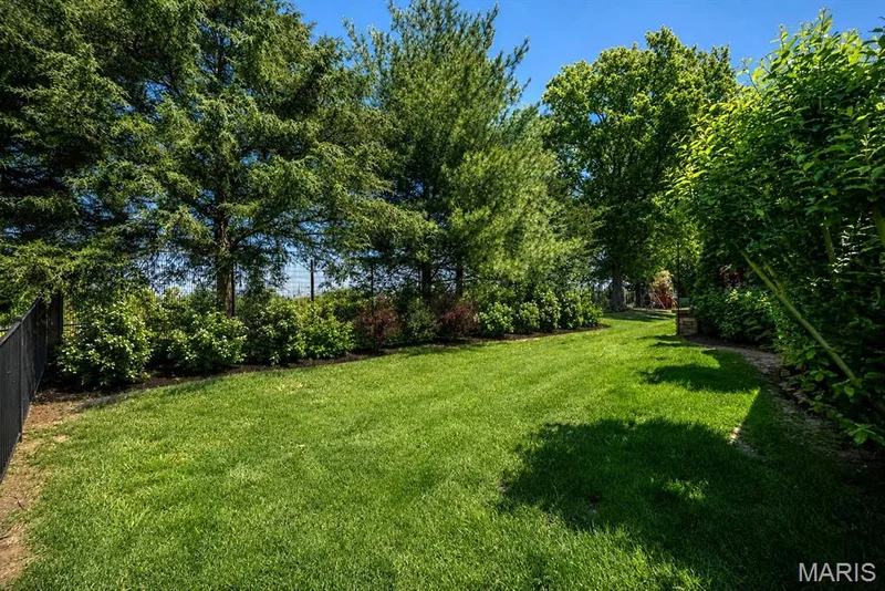 AI-enhanced image to illustrate potential landscaping. — 233 Fox Haven Drive, O'Fallon, MO 63368