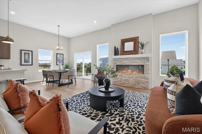 The open-concept design creates a seamless flow between the great room, dining area, and kitchen, offering the perfect space for everyday living, entertaining, and staying connected with family and guests. — 86 River Wind Drive, St Charles, MO 63301