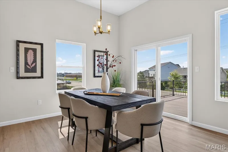 Enjoy casual meals in the spacious breakfast area, thoughtfully positioned between the kitchen and outdoor living space to create a comfortable setting for everyday dining and entertaining. — 86 River Wind Drive, St Charles, MO 63301