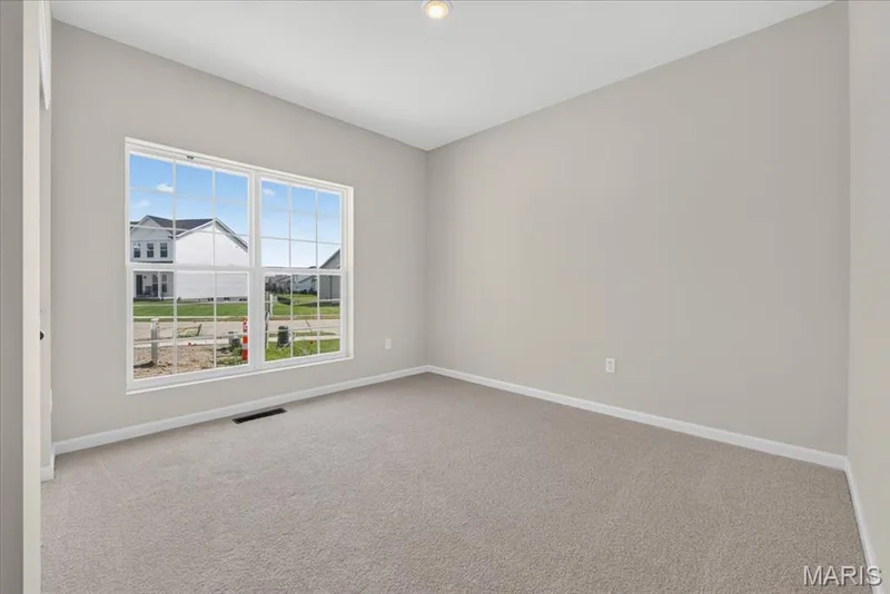 The secondary bedrooms provide the ideal combination of space and comfort, featuring generous dimensions, large windows, and ample closet storage to create welcoming retreats for family members or visitors. — 86 River Wind Drive, St Charles, MO 63301