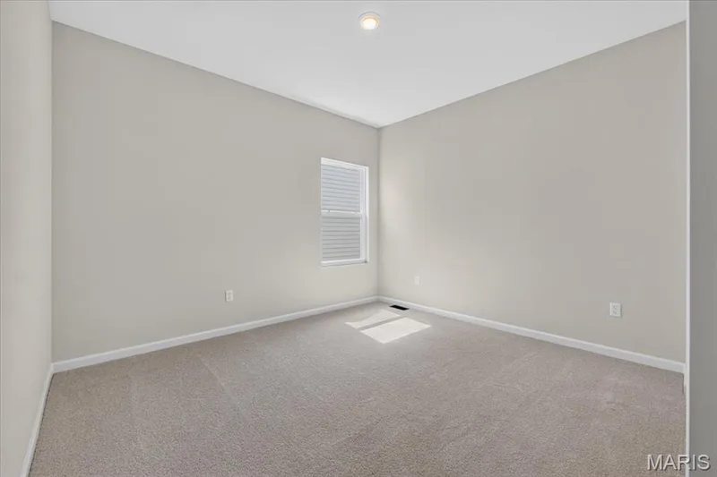 Each secondary bedroom is thoughtfully designed with spacious layouts, large closets, and windows that create warm, comfortable spaces everyone will enjoy. — 86 River Wind Drive, St Charles, MO 63301