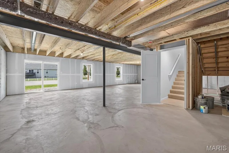 The expansive walk-out lower level offers endless possibilities to create additional living space, including a recreation room, home theater, fitness area, guest suite, or home office, all while maintaining plenty of room for storage. — 86 River Wind Drive, St Charles, MO 63301