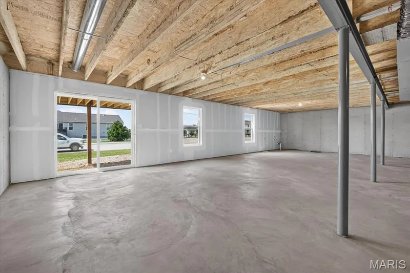 A full walk-out basement provides abundant natural light and direct access to the backyard, creating the perfect opportunity to finish the space to fit your lifestyle while adding valuable square footage. — 86 River Wind Drive, St Charles, MO 63301