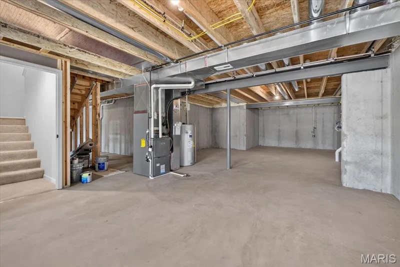 The bright walk-out lower level offers exceptional flexibility with abundant natural light, direct access to the backyard, and an open layout that's ready to be transformed into the additional living space you've always wanted. — 86 River Wind Drive, St Charles, MO 63301