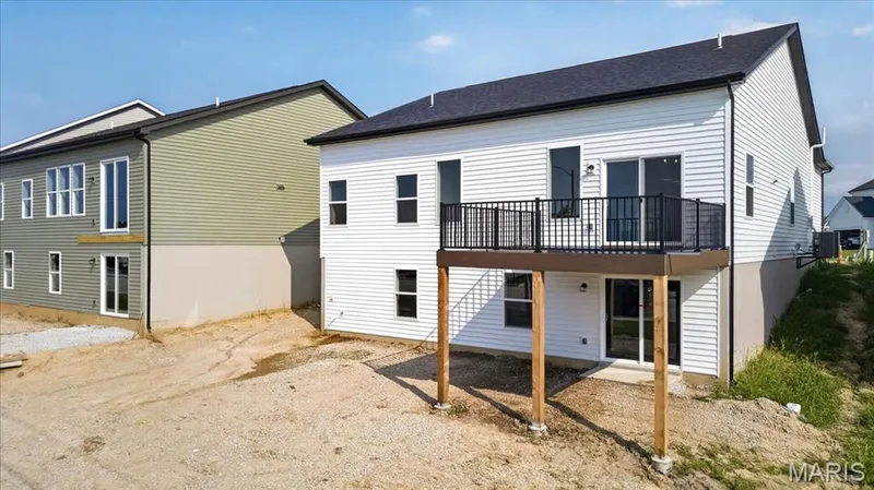 Enjoy the best of indoor-outdoor living with a low-maintenance composite deck, ideal for entertaining or relaxing, while the walk-out lower level offers abundant natural light and direct access to the backyard for future expansion. — 86 River Wind Drive, St Charles, MO 63301
