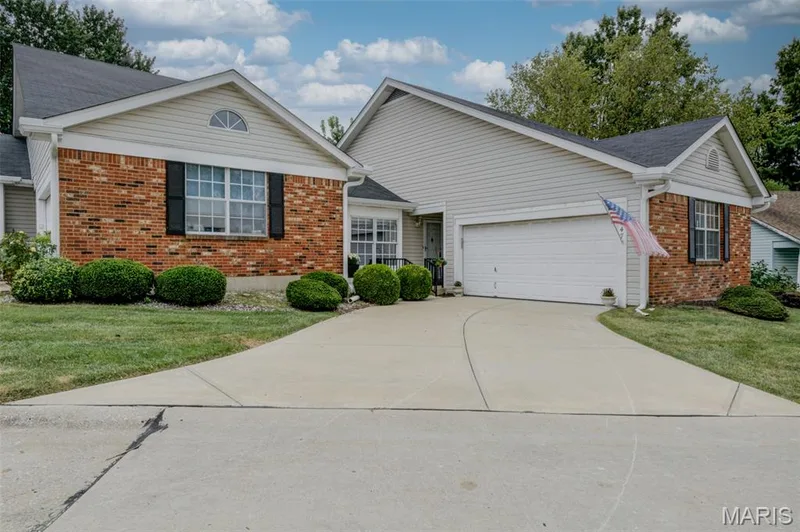 Brick front with vinyl siding - Two-car front entry garage! — 1647 Chapman Court, St Charles, MO 63303