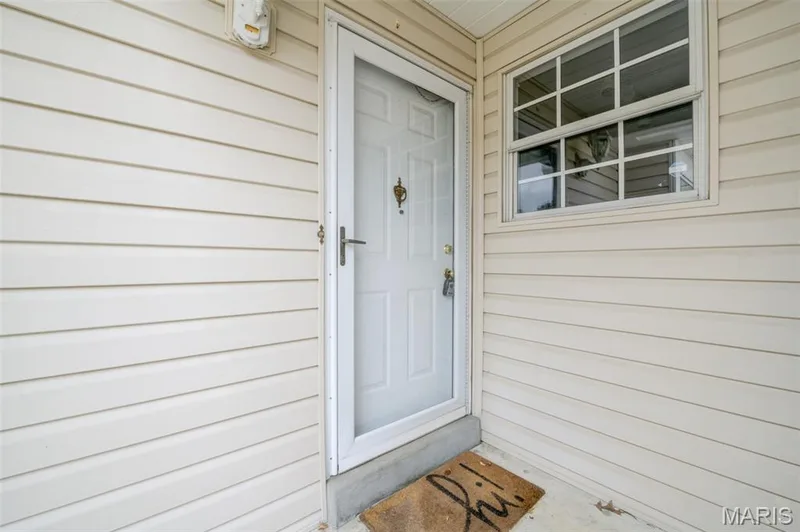 Small front porch leading to front door. — 1647 Chapman Court, St Charles, MO 63303