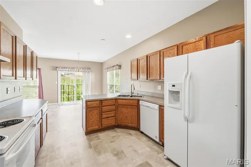 Kitchen into Breakfast Room — 1311 Pine Bluff Drive, St Charles, MO 63304