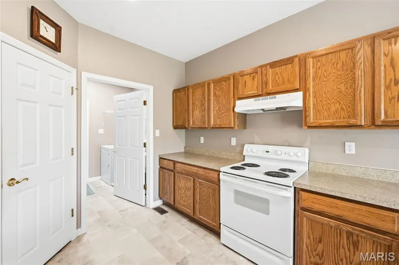 Kitchen into Main Floor Laundry Room — 1311 Pine Bluff Drive, St Charles, MO 63304