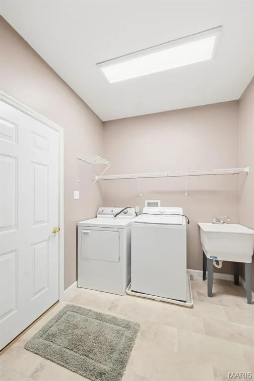 Main Floor Laundry and access to 2-car garage — 1311 Pine Bluff Drive, St Charles, MO 63304