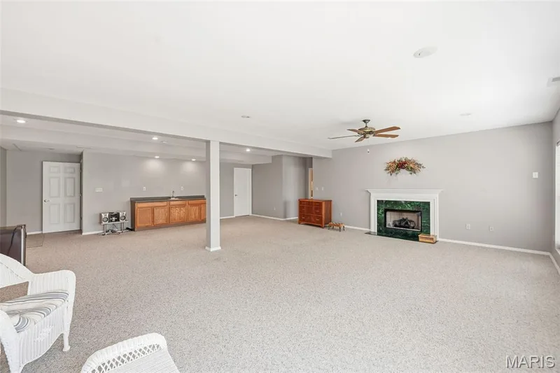 Walk-out to gas fireplace — 1311 Pine Bluff Drive, St Charles, MO 63304