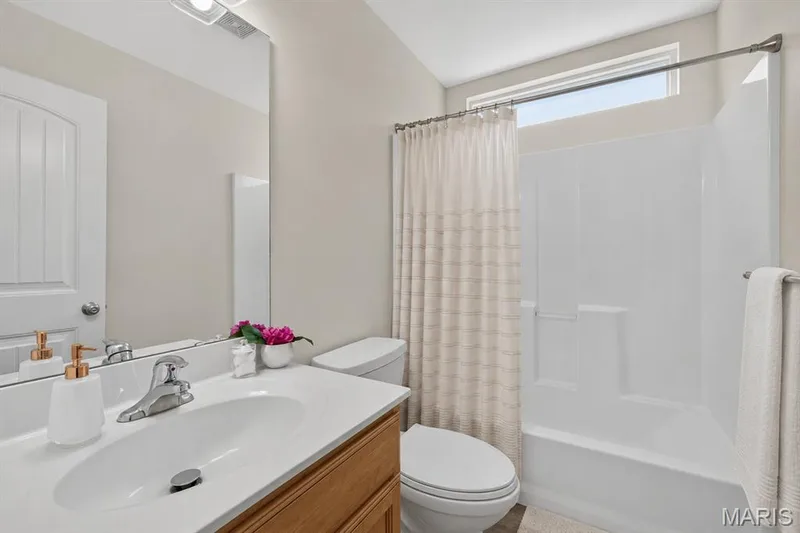 Virtually staged main floor bathroom. — 4216 Broken Rock Drive, Wentzville, MO 63385