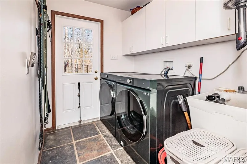 Main Floor Laundry features Tile floors and an a wet sink for washing delicates and a exterior door. — 4600 Cliff Forest Drive, Wildwood, MO 63069