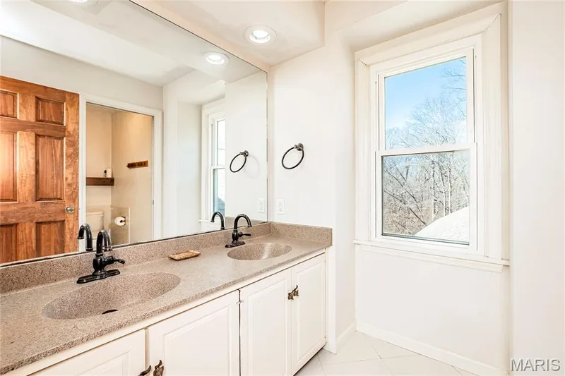 Second Bathroom  features Double Sink, and Window View. — 4600 Cliff Forest Drive, Wildwood, MO 63069