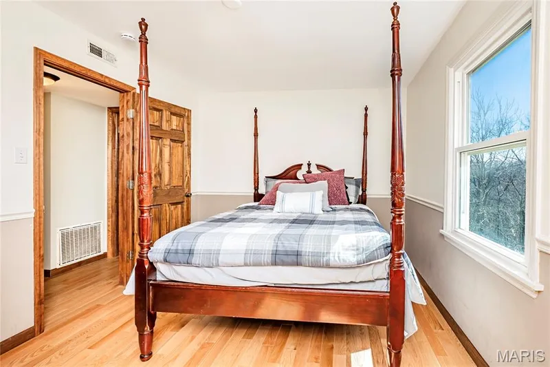Third Bedroom upstairs amenities include Wood Floors and Wood Trim. — 4600 Cliff Forest Drive, Wildwood, MO 63069