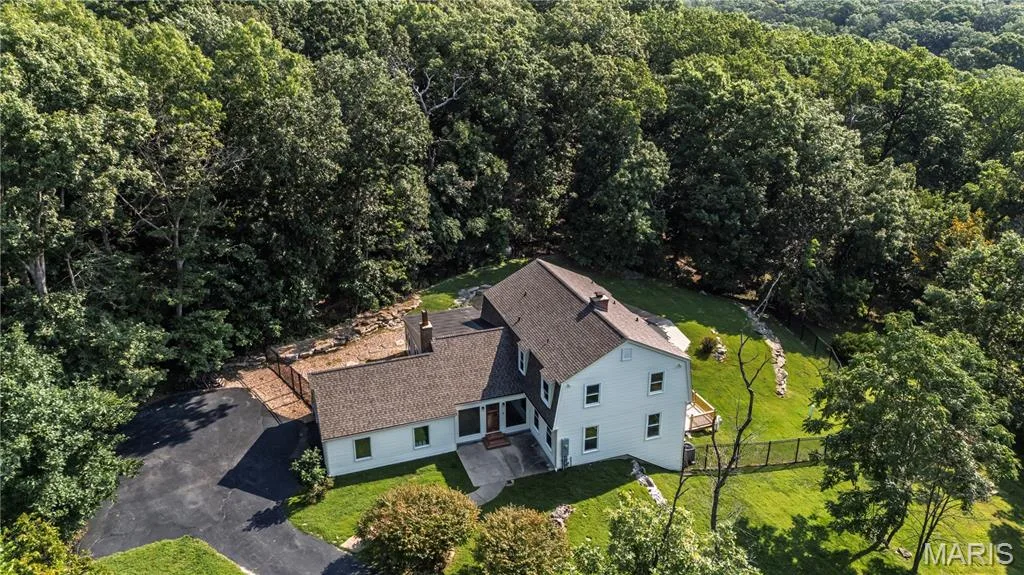 Lovely Wildwood property, 5 Bedrooms, 3.5  Baths sitting on 3.8 acres backing to Rockwood range.  Beautiful salt water pool and a large patio. — 4600 Cliff Forest Drive, Wildwood, MO 63069