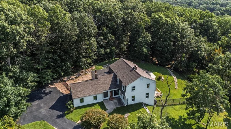Lovely Wildwood property, 5 Bedrooms, 3.5  Baths sitting on 3.8 acres backing to Rockwood range.  Beautiful salt water pool and a large patio. — 4600 Cliff Forest Drive, Wildwood, MO 63069