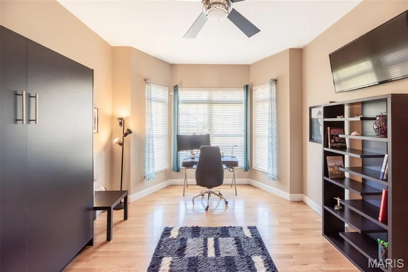 main floor office / bedroom with built in Murphy Bed — 197 Woodland Place Court, St Charles, MO 63303