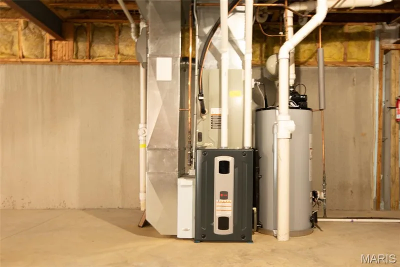Utilities featuring gas water heater and heating unit — 197 Woodland Place Court, St Charles, MO 63303