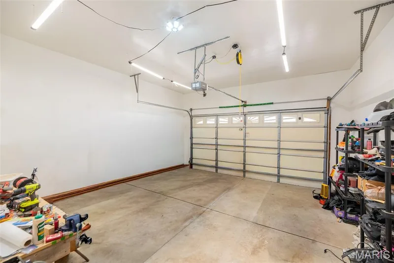 Garage featuring a garage door opener — 197 Woodland Place Court, St Charles, MO 63303