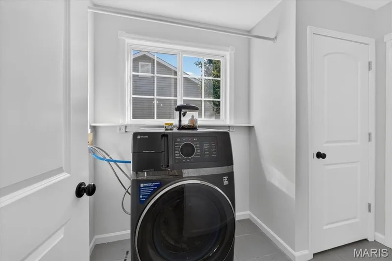 Main-floor laundry adds convenience to single-story living — 2707 Post Meadows Drive, O'Fallon, MO 63368