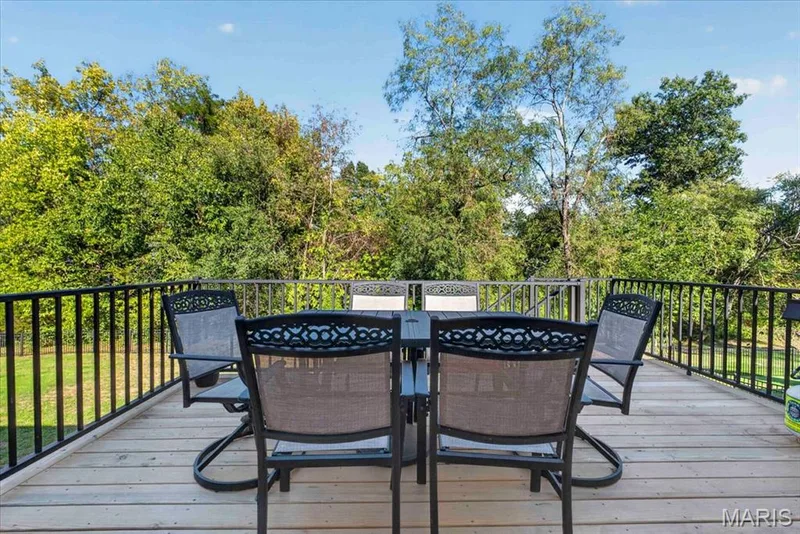 Step outside to the BRAND-NEW deck and enjoy peaceful backyard views — 2707 Post Meadows Drive, O'Fallon, MO 63368