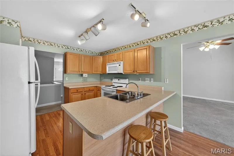 Wood Cabinets & Directional Lights! — 12 Shimmering Lake Court, St Charles, MO 63301