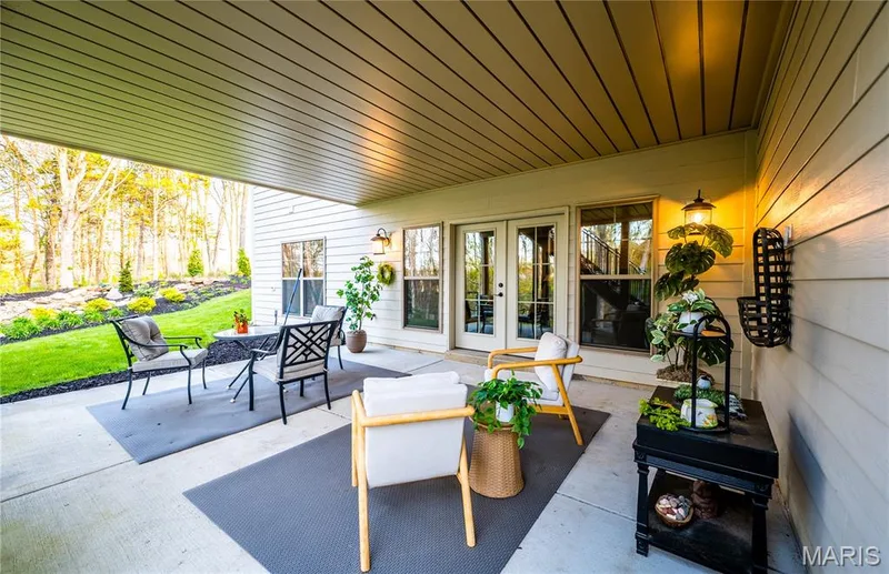 Sitting out on the patio the deck has Quality edge Underdecking roof system for out of the weather enjoyment. — 150 Delcreek Estates Drive, Foristell, MO 63348