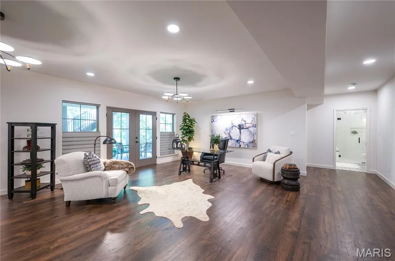 French doors lead to covered patio to enjoy the sounds of the pond running — 150 Delcreek Estates Drive, Foristell, MO 63348