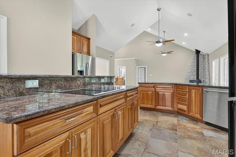 Opens to the breakfast area and separate dining room for easy entertaining — 18517 Gredan Court, Wildwood, MO 63069